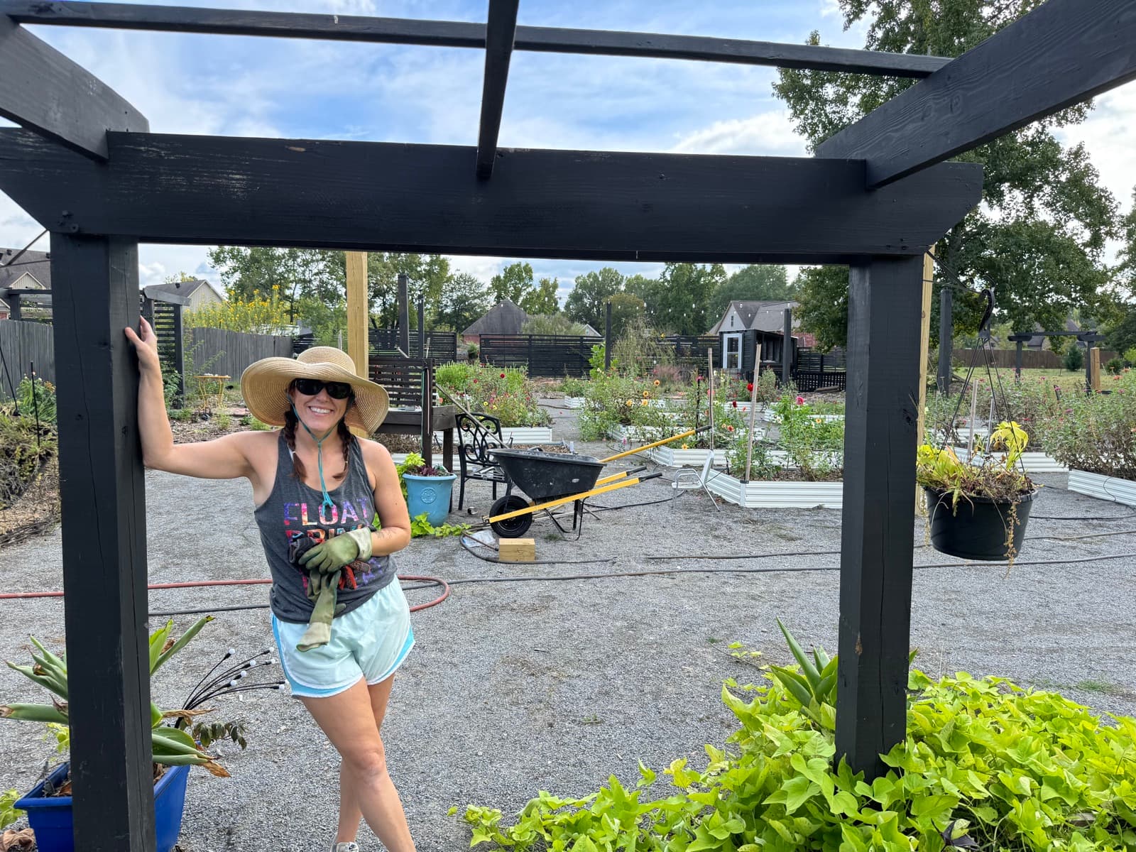 Lauren smiling under the pergola at the farm